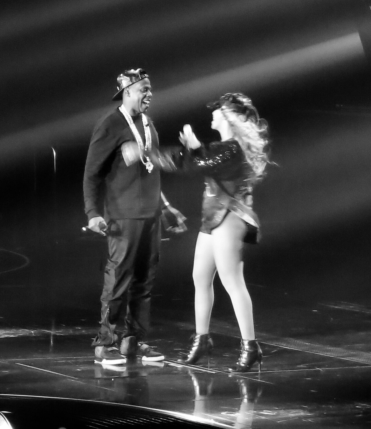 Beyoncé and Jay-Z embracing on stage during The Mrs. Carter Show World Tour.